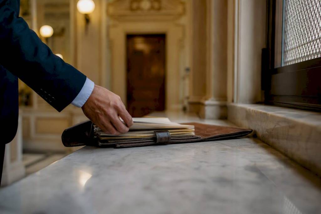Legal folder on courtroom bench before arraignment